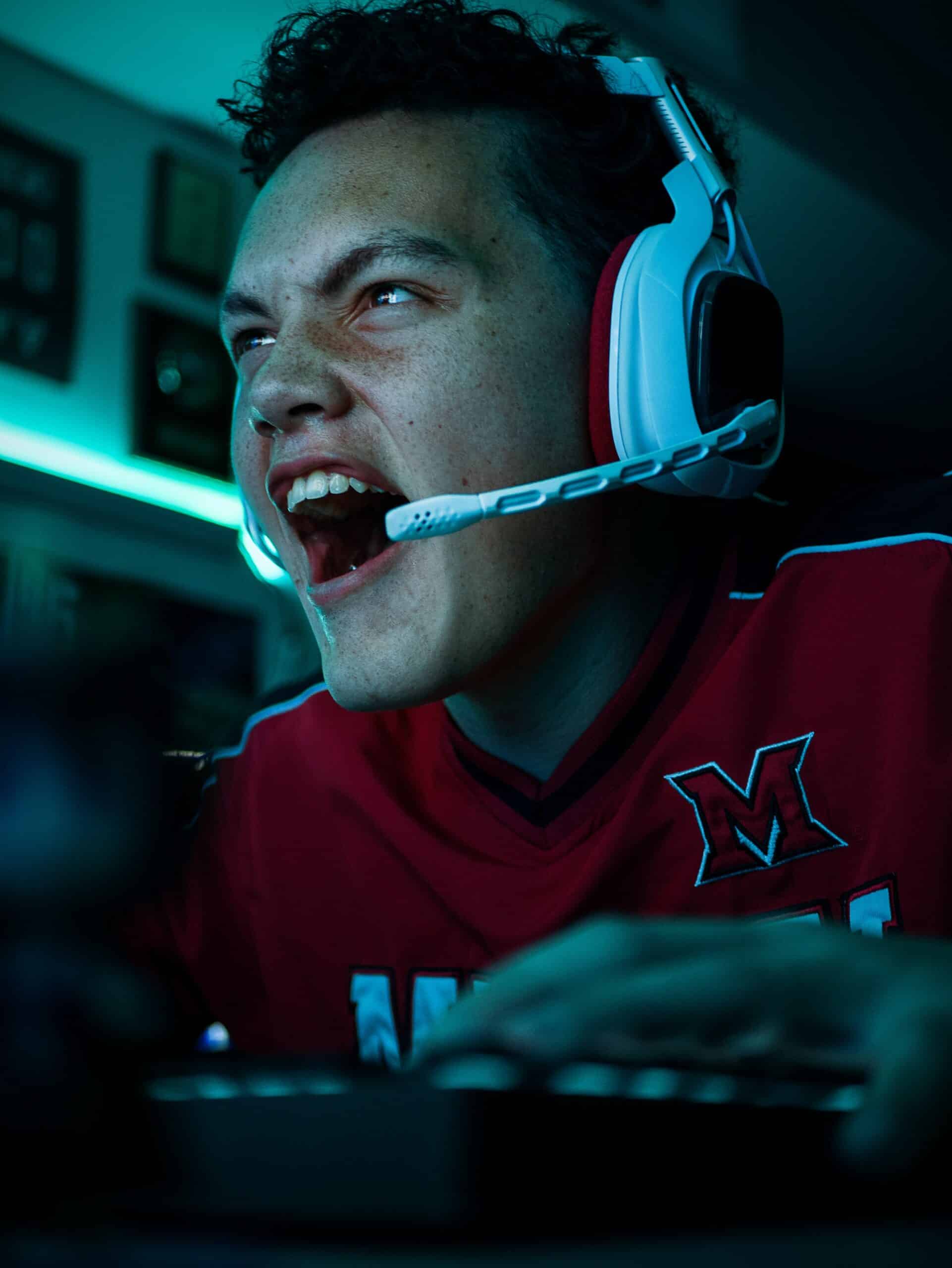 A computer gamer enthusiastic playing in an e-sports competition